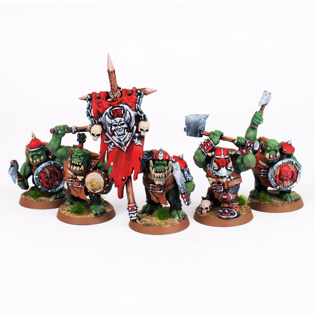 Painted Orc Warriors miniature regiment with axes, shields, and banner